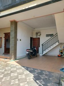 a motorcycle parked in the middle of a garage at Nuke's guest house in Canggu