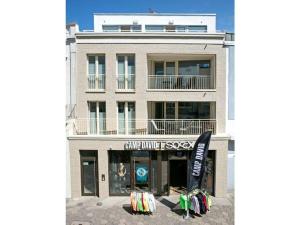 a building with a sign in front of it at Old Printing House Holiday Apartment Gutenberg in Norderney