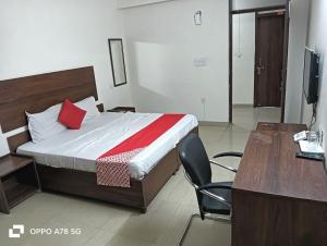 En eller flere senger på et rom på Hotel Mittal Tower