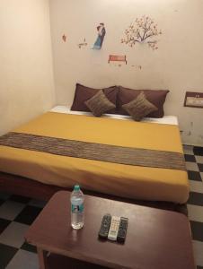 A bed or beds in a room at CGR PONDY