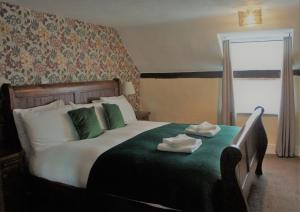 Postel nebo postele na pokoji v ubytování Star Inn Hotel