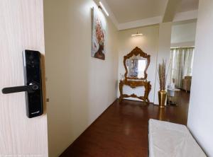 a room with a mirror and a chair at Genesis villa in Guwahati