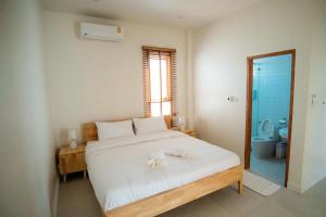 Voodi või voodid majutusasutuse Sunn Lay Pool Villa toas
