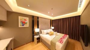Ein Bett oder Betten in einem Zimmer der Unterkunft Imperial KLCC Residence