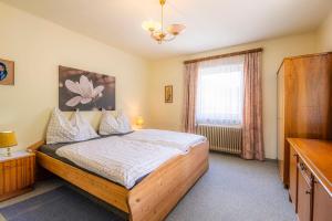 Postel nebo postele na pokoji v ubytování Achenhaus