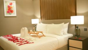 Ein Bett oder Betten in einem Zimmer der Unterkunft Imperial KLCC Residence