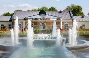 a fountain in front of a building at Europa Royale Druskininkai in Druskininkai