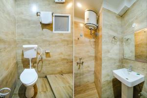 two pictures of a bathroom with a toilet and a sink at FabExpress Anurag Residency in Guwahati