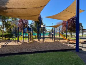 a park with a playground with a slide at Payneham South Paradise Suite 1 in Norwood