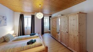 Postel nebo postele na pokoji v ubytování Chasa Silvretta