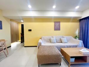 a hotel room with a bed and a table at Anping Nordic sea view three bedrooms in Anping