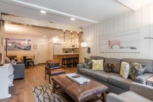 a living room with a couch and a table at Fully Renovated! St Anton #17 Ski in Ski Out 1 Bedroom 1 Bathroom Condo! Sleeps up to 4! in Mammoth Lakes
