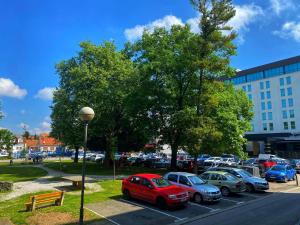 a group of cars parked in a parking lot at ASTORIA in Varaždin