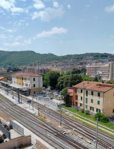 a view of a city with train tracks and buildings at Vecchio Treno guest house in Tivoli