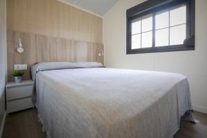 Postel nebo postele na pokoji v ubytování Camping Urbion