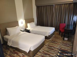 Letto o letti in una camera di Harbour View Hotel