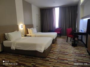 Letto o letti in una camera di Harbour View Hotel