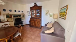 a living room with a couch and a table at La Terrazza sul Mare Sea View - near best beaches in Monterosso al Mare