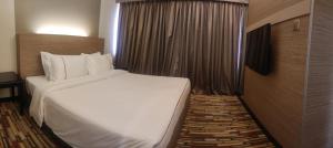 Letto o letti in una camera di Harbour View Hotel
