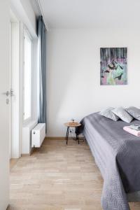 Postel nebo postele na pokoji v ubytování Modern 1BR Apartment with Sauna & Balcony - Hosted by 2ndhomes