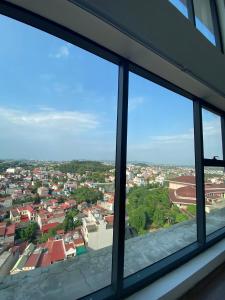 a view of a city from a window at Mandala Apartment Hotel in Bắc Ninh