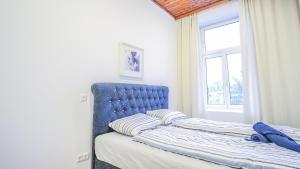Una cama o camas en una habitación de Comfortable Accommodations in the Alterlaa Area LV3