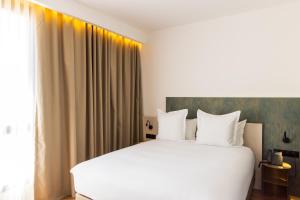 DIAGONAL HOTEL客房内的一张或多张床位