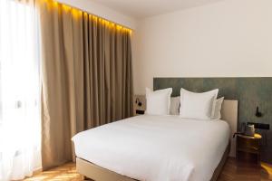 DIAGONAL HOTEL客房内的一张或多张床位