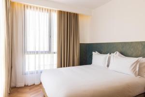 DIAGONAL HOTEL客房内的一张或多张床位