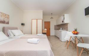 Postel nebo postele na pokoji v ubytování Dora's Apartments