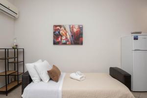 Postel nebo postele na pokoji v ubytování Dora's Apartments
