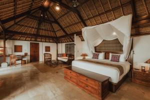 Postel nebo postele na pokoji v ubytování Jimbaran Puri, A Belmond Hotel, Bali