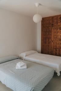 Postel nebo postele na pokoji v ubytování CasaMarga San José Precioso apartamento con piscina y vistas al mar