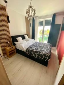 Postel nebo postele na pokoji v ubytování Apartament Komfortowy - Basen - Perłowa Przystań