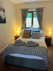 Postel nebo postele na pokoji v ubytování Lilac Cottage