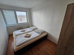 เตียงในห้องที่ Ubytovanie Terchová 68