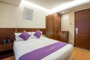 Voodi või voodid majutusasutuse The Bauhinia Hotel - Tsim Sha Tsui toas