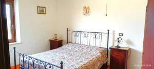 A bed or beds in a room at Casavacanze Pergolino, appartamenti ad uso esclusivo