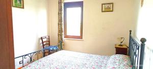 A bed or beds in a room at Casavacanze Pergolino, appartamenti ad uso esclusivo
