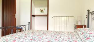 A bed or beds in a room at Casavacanze Pergolino, appartamenti ad uso esclusivo