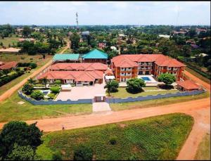an overhead view of a large house with a road at Fresh World Hotel in Lira