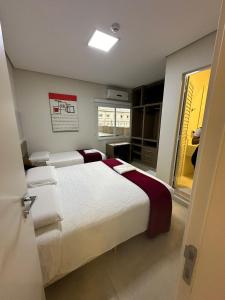 Postel nebo postele na pokoji v ubytování Hotel Imperatriz