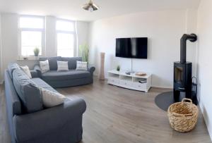 TV a/nebo společenská místnost v ubytování Ferienwohnung Nr 2