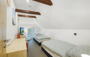Кровать или кровати в номере Alpaka Ferienhaus Schmatzin