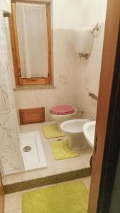 a bathroom with a toilet and a sink at One bedroom apartement with city view and furnished terrace at Vibo Valentia in Vibo Valentia