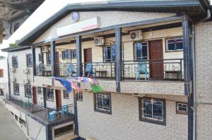 a building with flags on the side of it at DF HOTEL plazza in Yaoundé