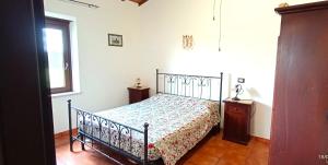 A bed or beds in a room at Casavacanze Pergolino, appartamenti ad uso esclusivo