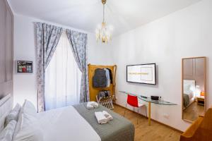Letto o letti in una camera di The Space Rooms