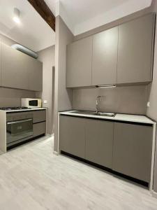 Kuchyň nebo kuchyňský kout v ubytování la casa del porto