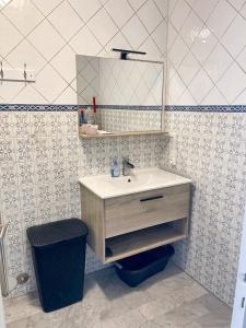 a bathroom with a sink and a mirror at Appartement d'une chambre a Nice a 200 m de la plage avec vue sur la mer terrasse et wifi in Nice